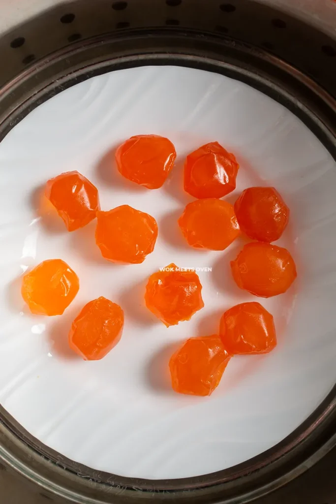 Putting egg yolks inside of steamer