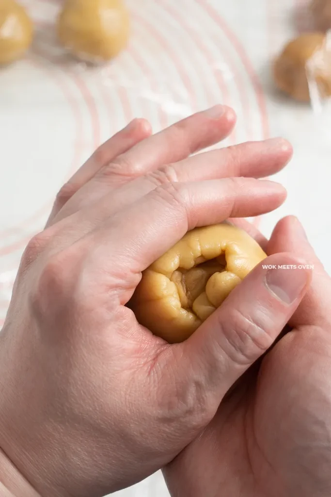 Wrapping dough over filling pic 3