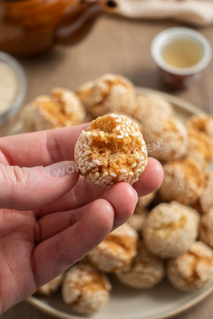 Hand holding smiling sesame ball