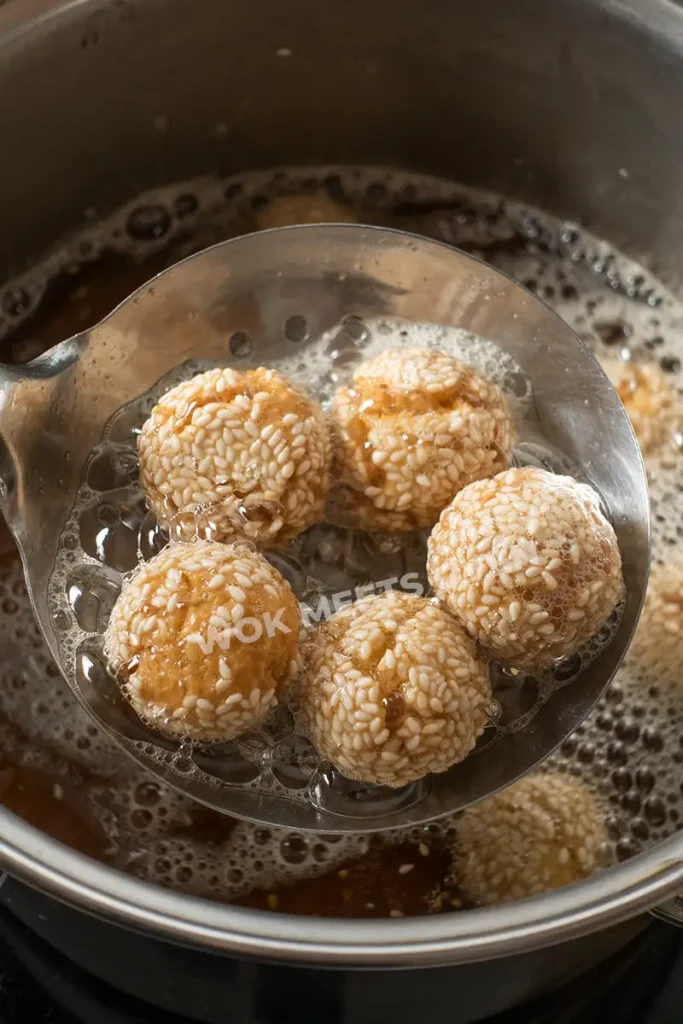 Scooping out smiling sesame balls