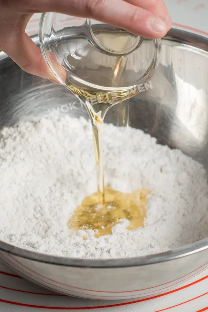 Adding in cooking oil to dry ingredients