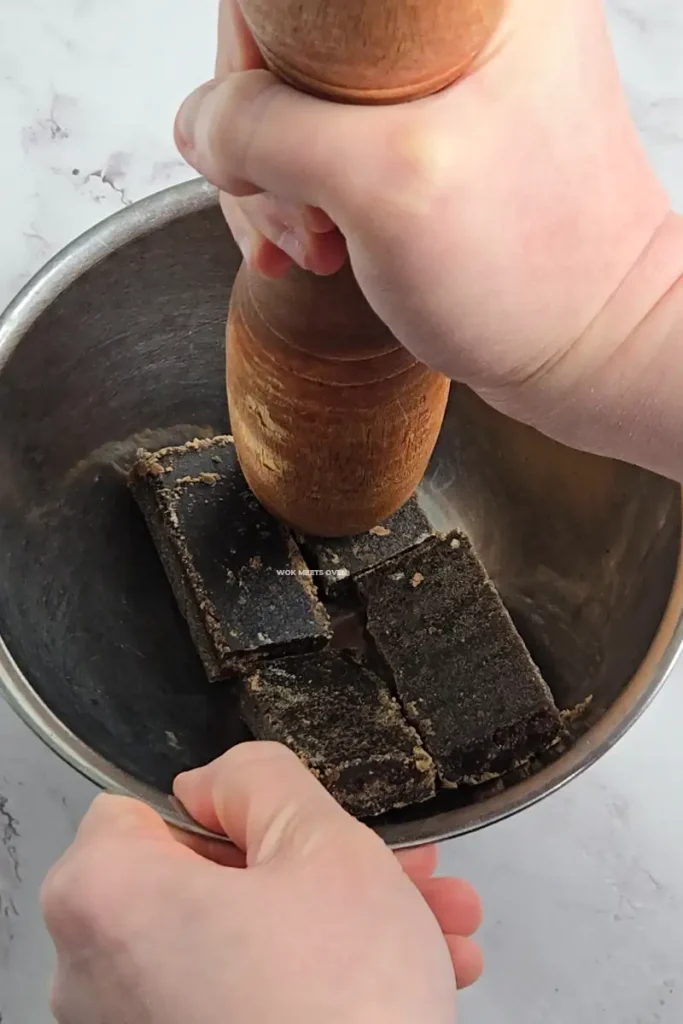 Breaking brown sugar into smaller pieces