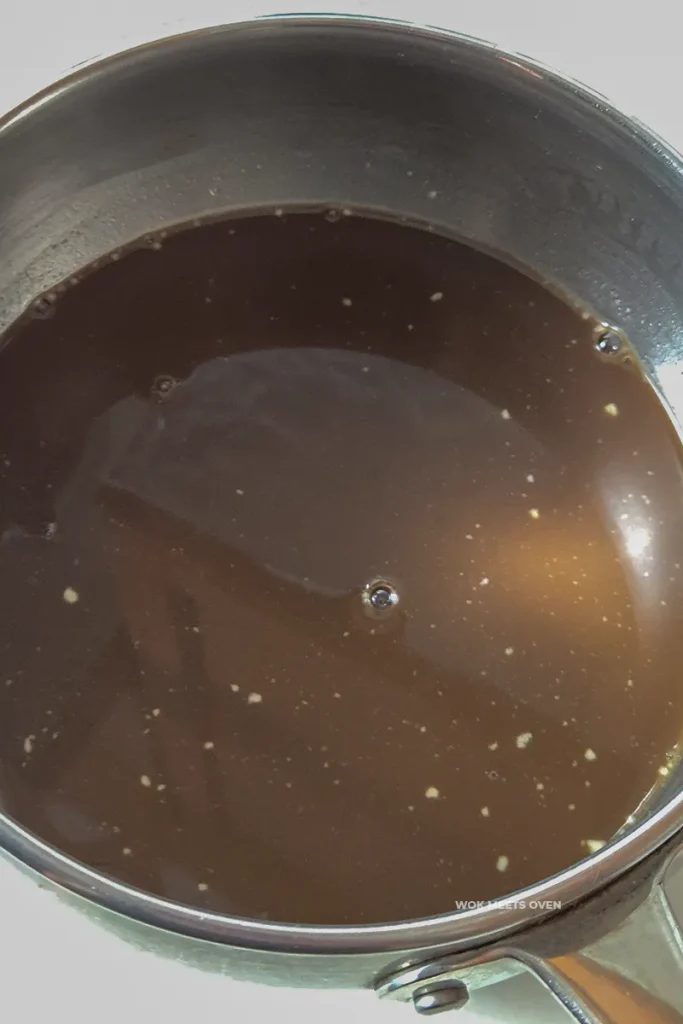 Coconut milk mixed with pot of brown sugar water