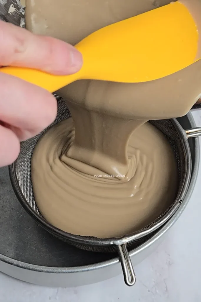 Pouring batter through a sieve