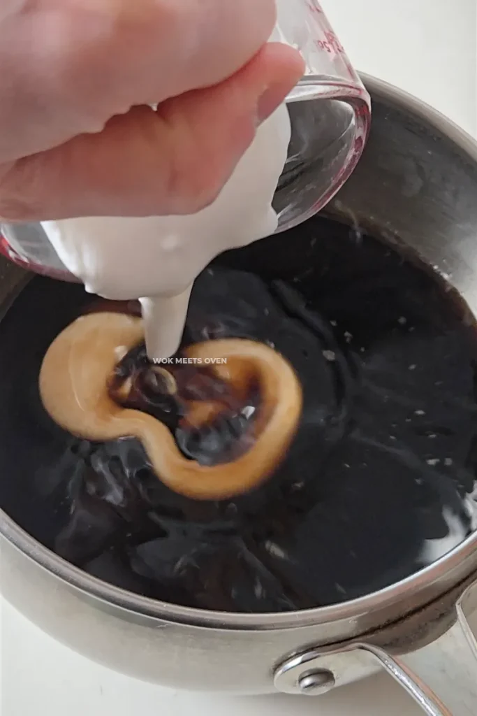 Adding in coconut milk to brown sugar water