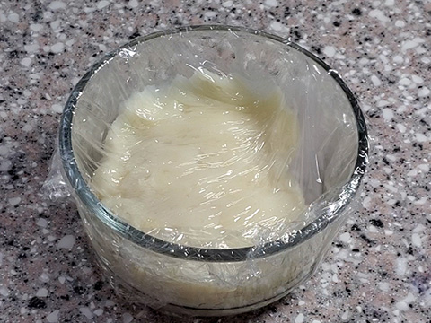 tangzhong inside of glass container with plastic wrap