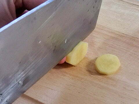 Slicing ginger into pieces