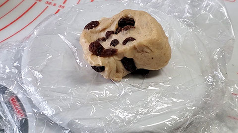 weighing raisin bread dough