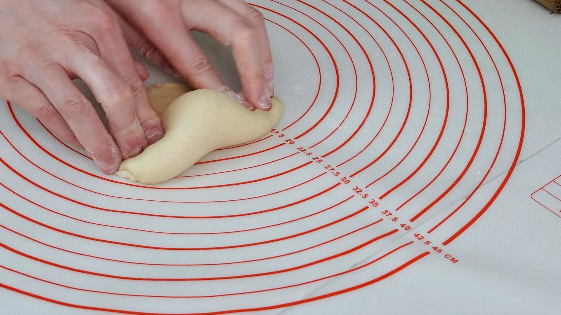 Rolling flatten dough to one side