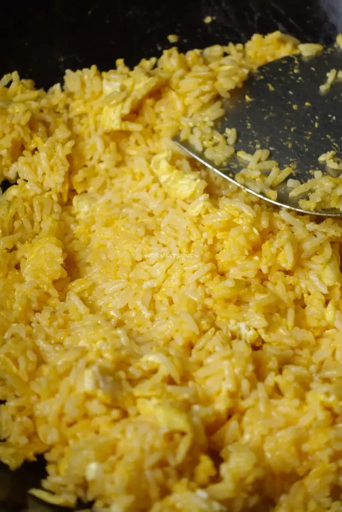 mixing rice with eggs