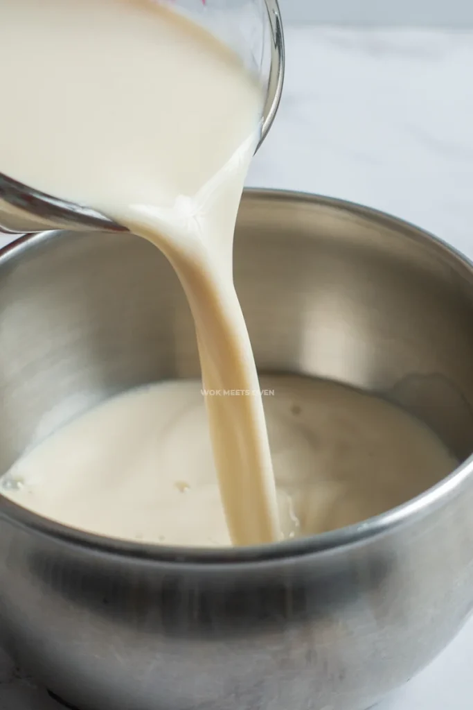 Pouring soy milk into pot