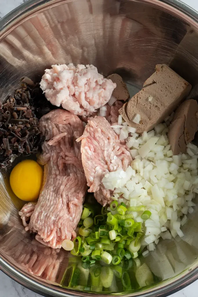 Filling ingredients inside of mixing bowl
