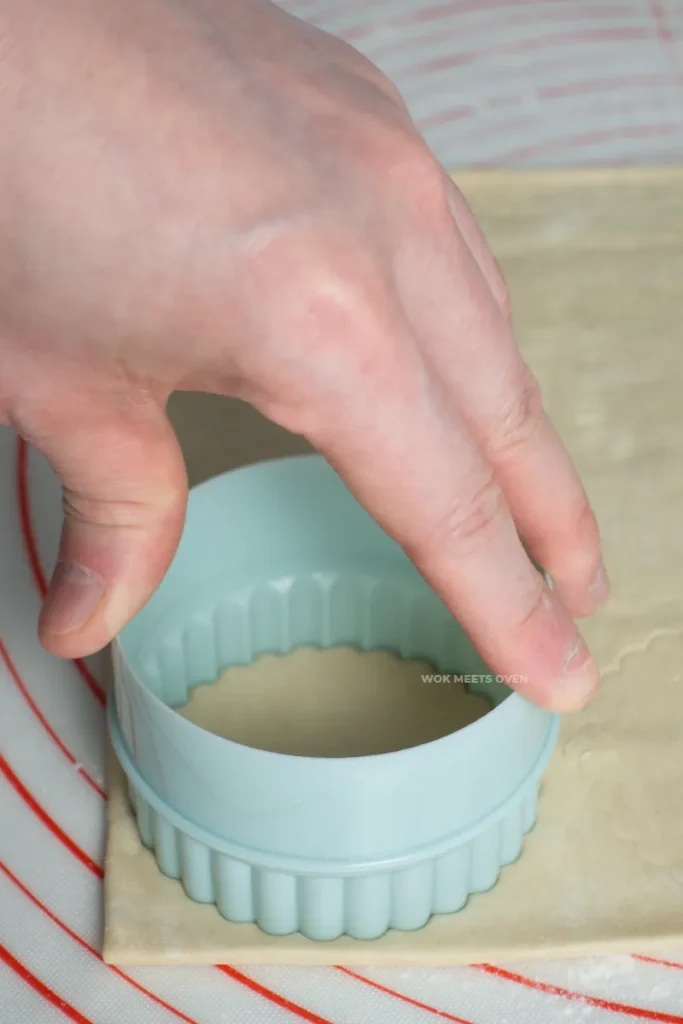 Cutting out puff pastry sheets using a cookie cutter