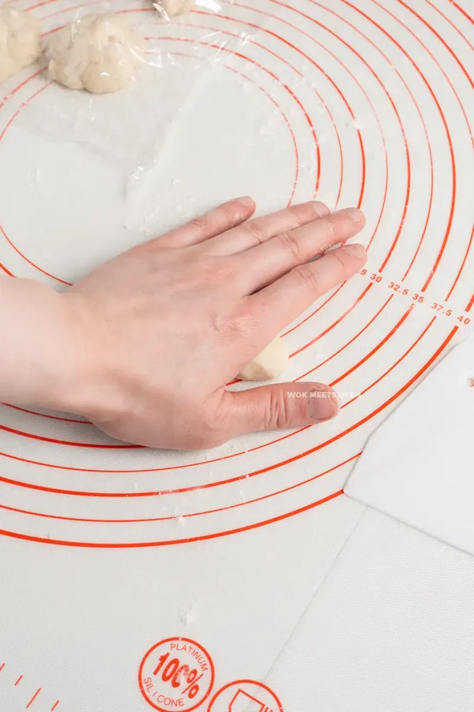 Slightly rolling each piece of dough