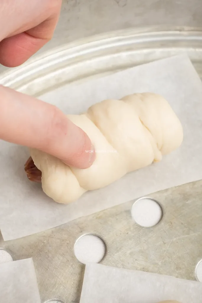 Pressing finger on bun