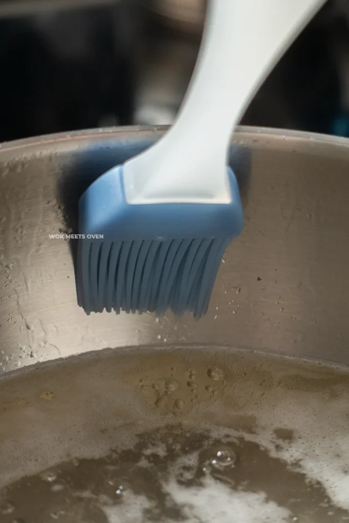 Brushing the pot with a wetted brush