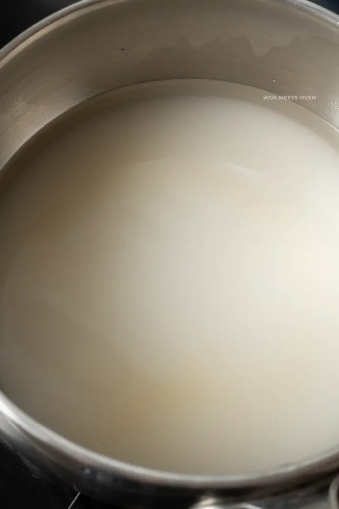 Sugar combined with water in pot