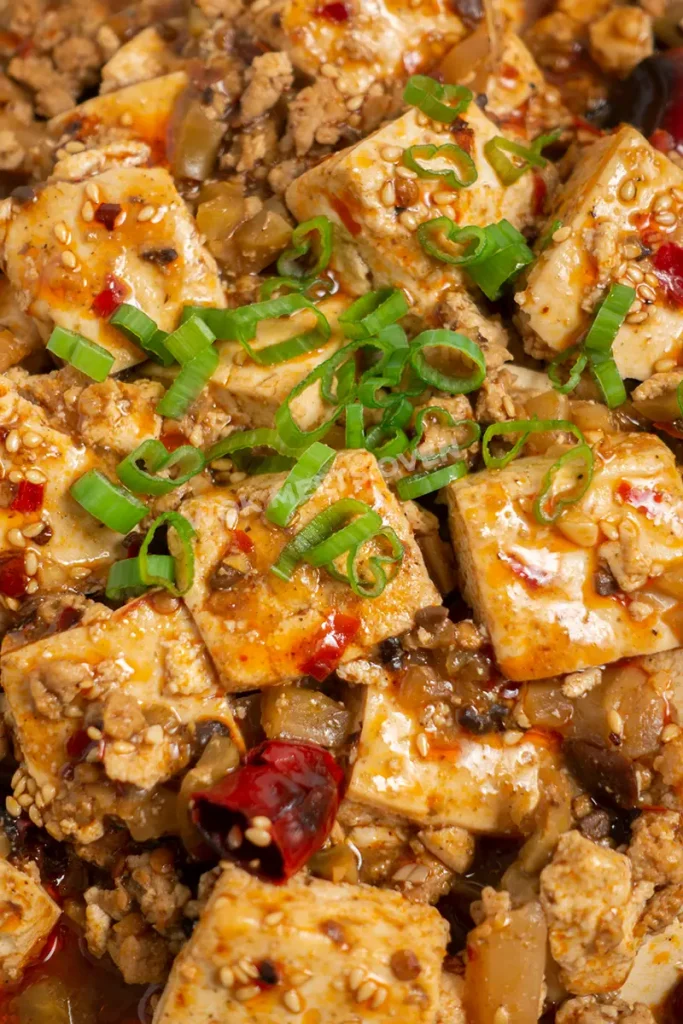 Green onions added to top of mapo tofu