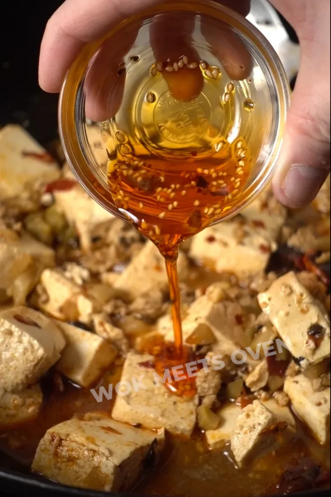 Chili oil added to mapo tofu