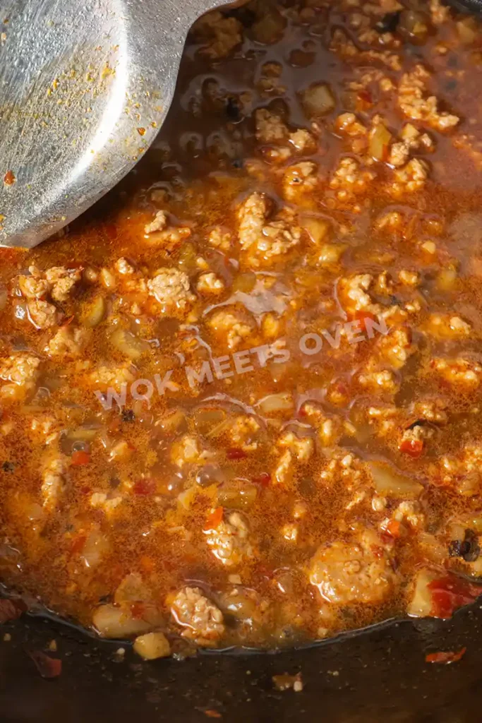 Mixing water in wok