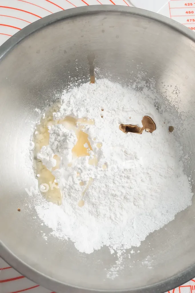 Adding in dry and wet ingredients into large bowl