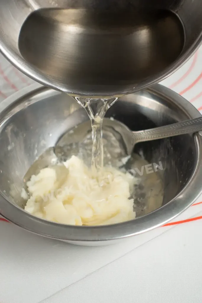 Adding in hot sugar water to mashed potatoes