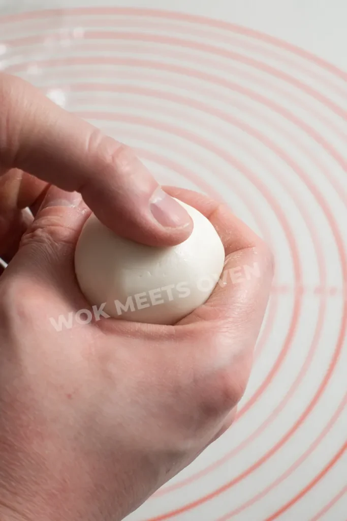 Shaping dough ball with filling inside step 1