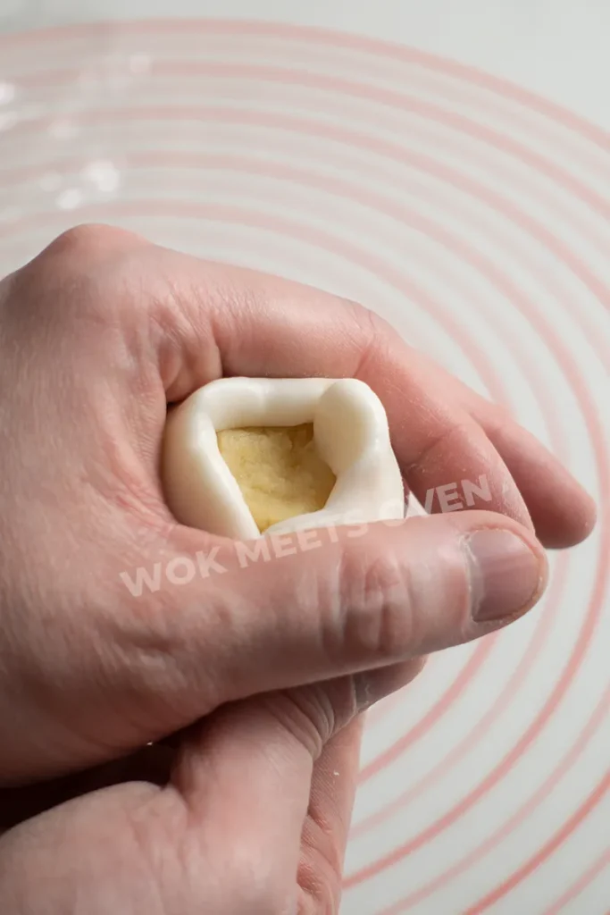Shaping dough ball with filling inside step 2