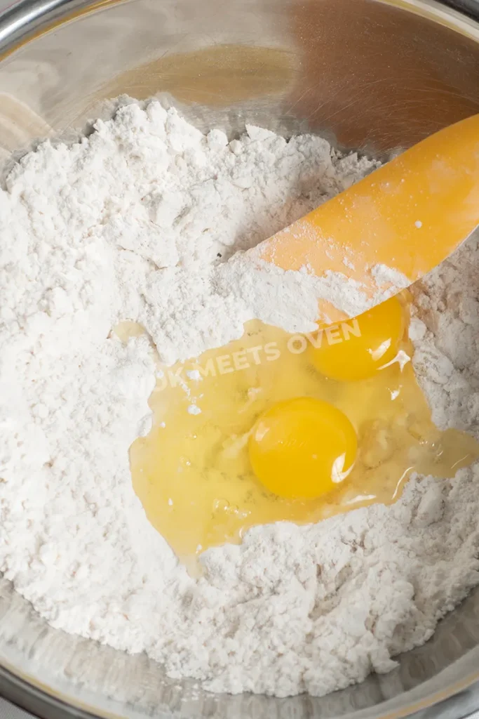 Adding in two eggs