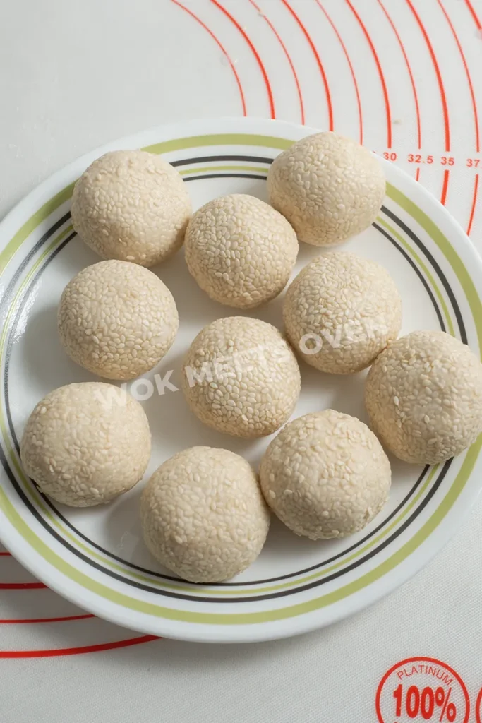 All dough balls covered in sesame seeds
