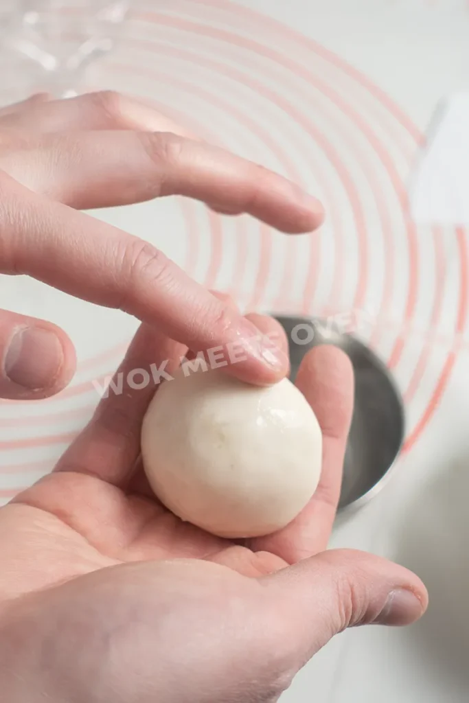 Rubbing water onto dough ball