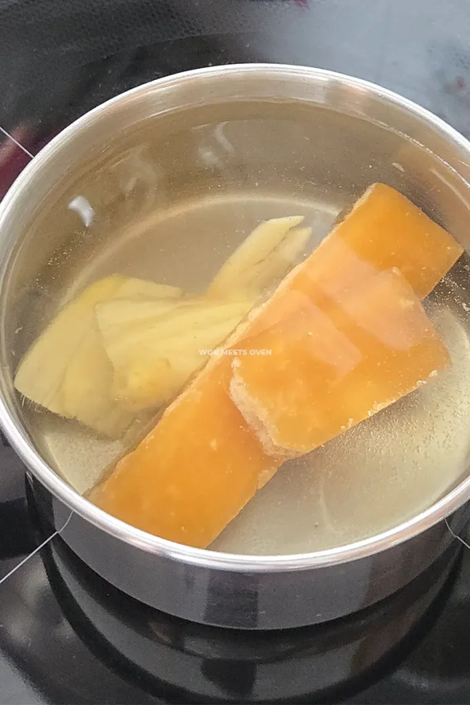 Brown sugar and ginger added to pot of water