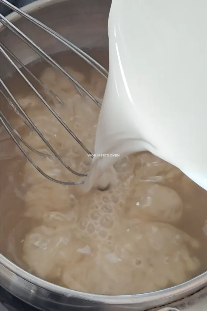 Pouring in water chestnut flour mixture into sugar water