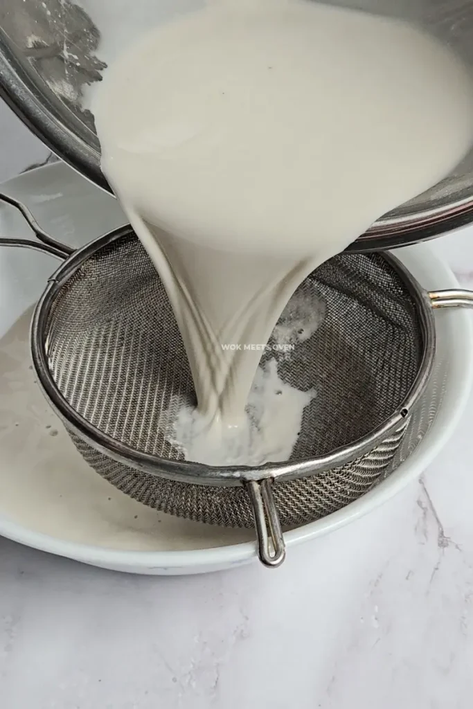 Pouring mixture through a sieve