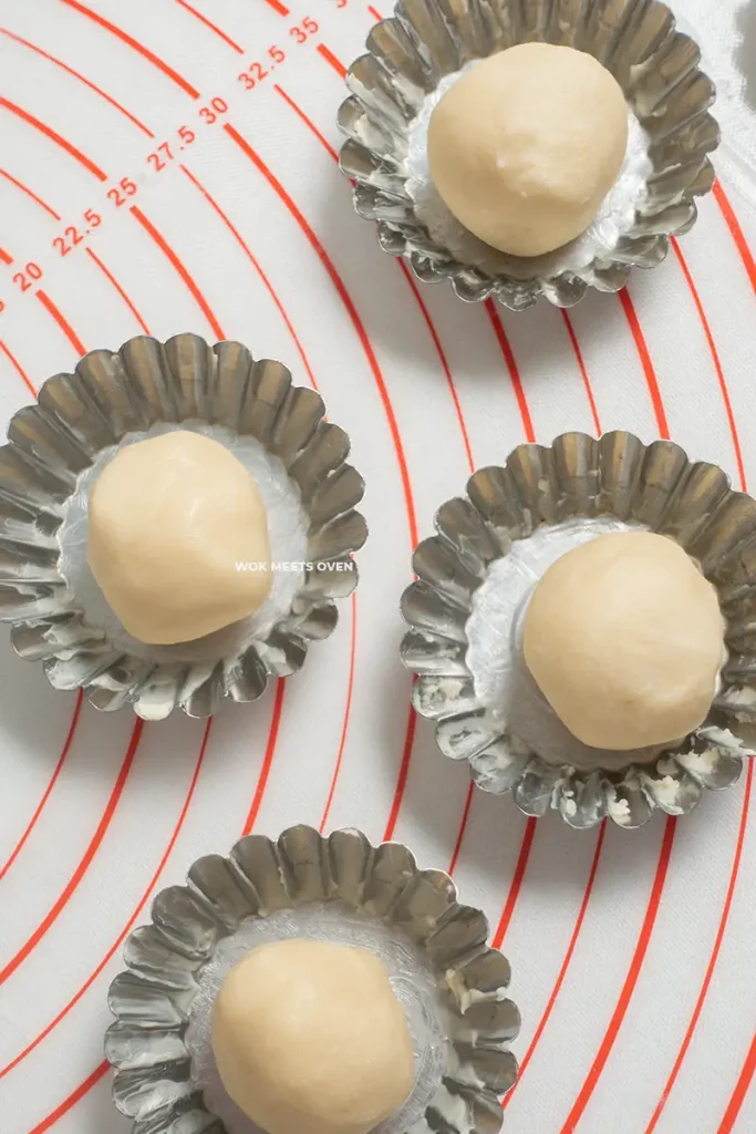 Dough added to tart molds