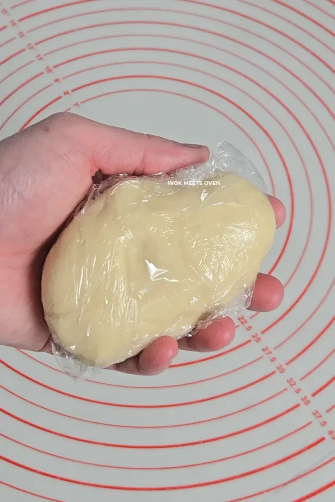Finished kneaded dough wrapped in plastic wrap